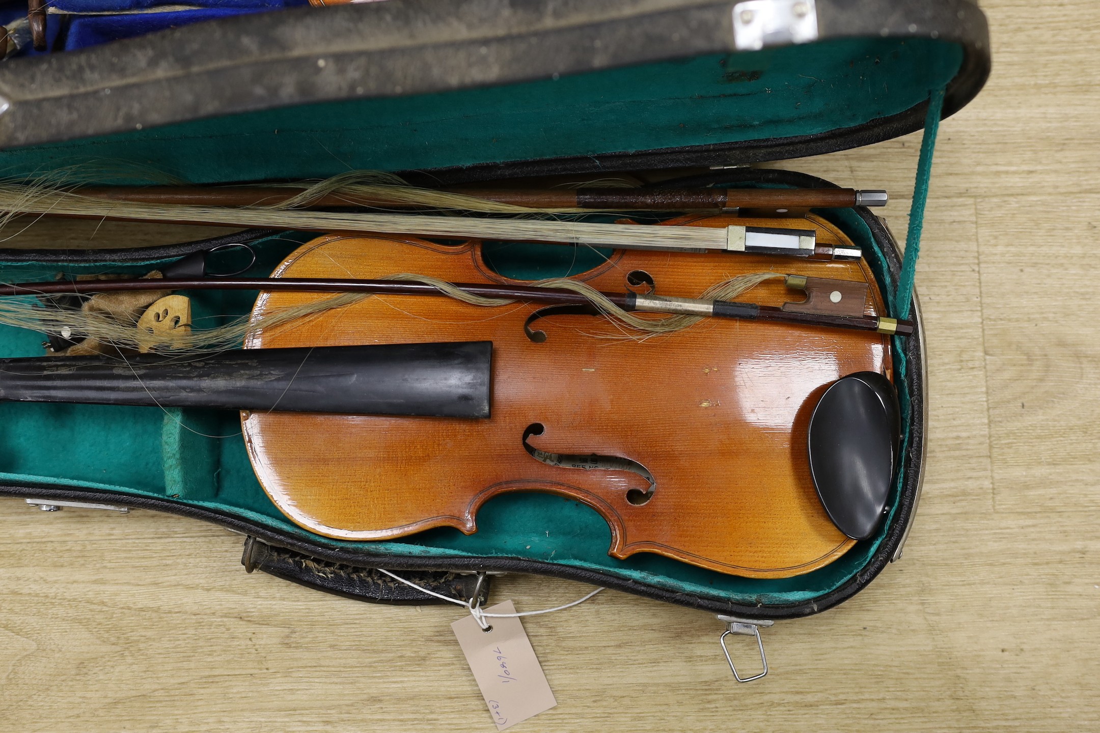 A double bass and three various violins, double bass 165cms high